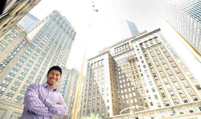 Ujjwal Pradhan '15 poses outside of his internship at Priority Capital Management.