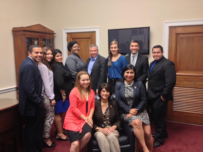 Monique St. Jarre, standing third from right, at an event for World Day Against Child Labor. At center in chair is Rep. Lucille Roybal-Allard, who is supporting a bill for the group.